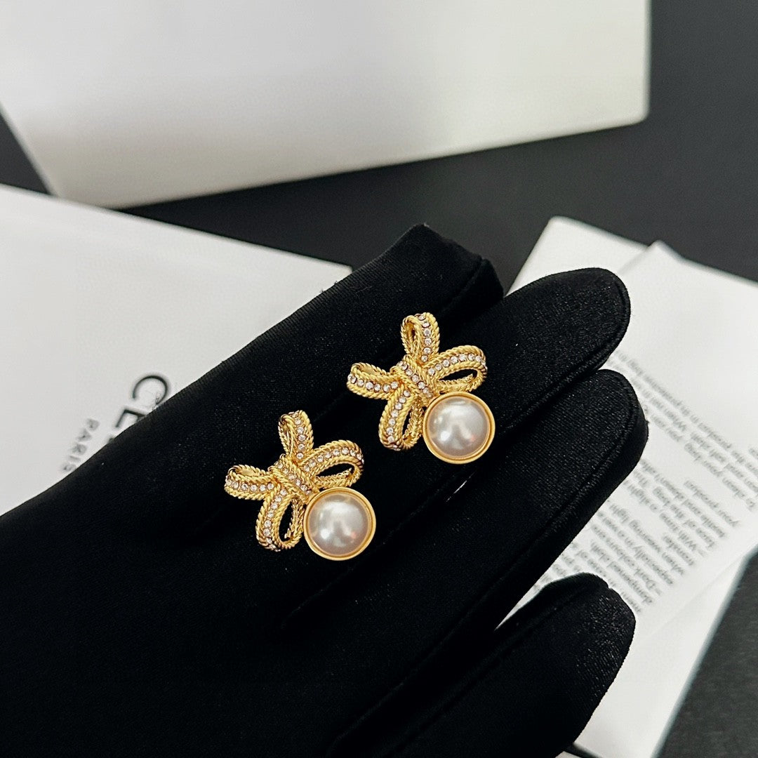 Signature Emblem Stud Earrings in Polished Metal-Tone – Design 04 styled detail