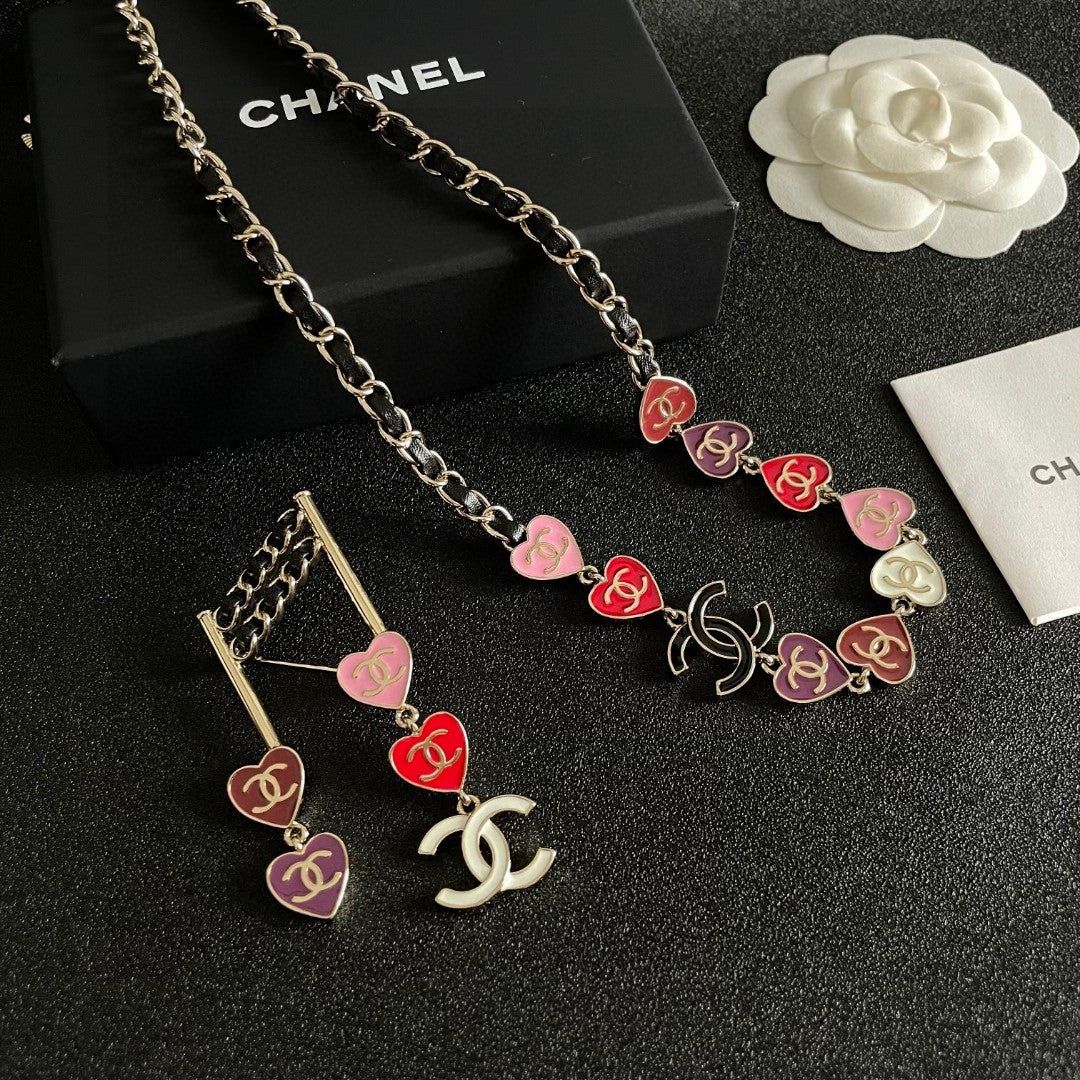 Double-C Emblem Brooch in Polished Metal-Tone – Heart Detail side detail