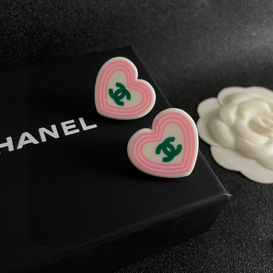 Double-C Emblem Stud Earrings in Polished Metal-Tone – Heart Detail – Design 004 detail view