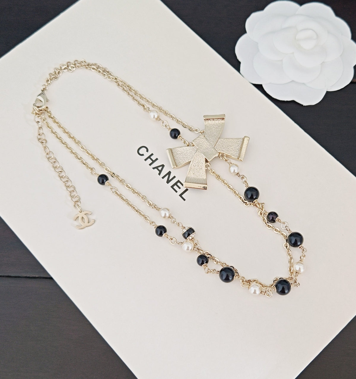 Bow Pendant Necklace in Gold-Tone – Black Detail – Design 003 styled product view