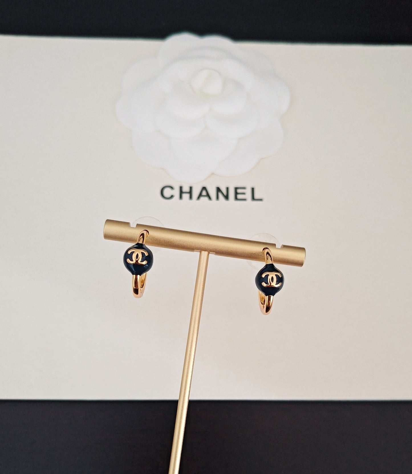 Signature Emblem Jewelry Accessory in Gold-Tone – Blue Detail close-up detail