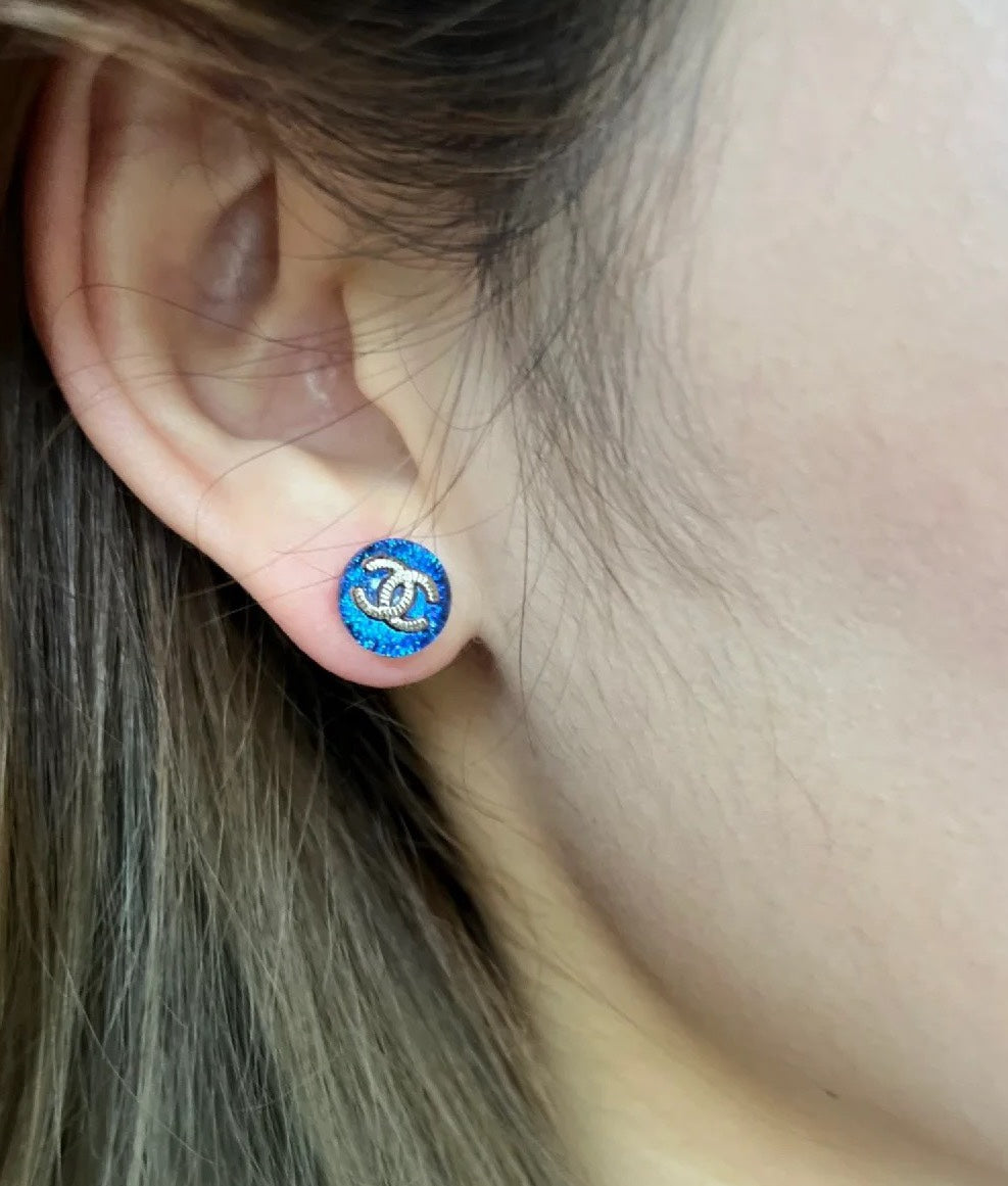 Signature Emblem Stud Earrings in Polished Metal-Tone – Blue Detail front product view