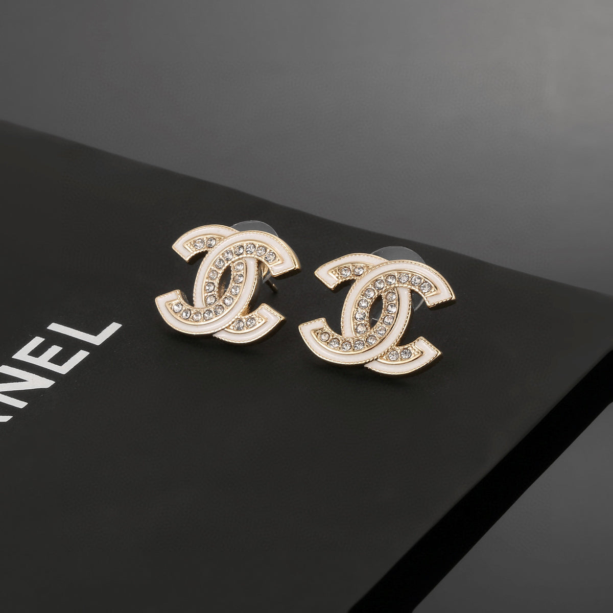 Double-C Emblem Stud Earrings in Polished Metal-Tone – Design 024 styled product view