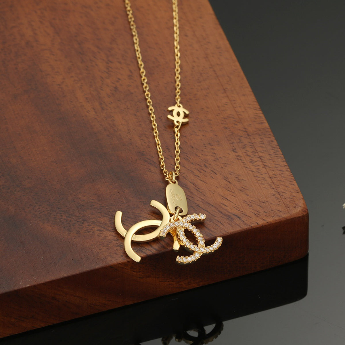 Double-C Emblem Pendant Necklace in Polished Metal-Tone – Design 001 detail view