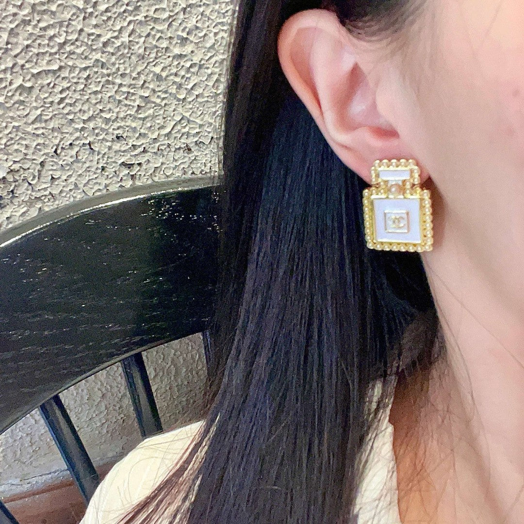 Double-C Emblem Pearl-Detail Stud Earrings – Pearl Detail – Design 026 detail view