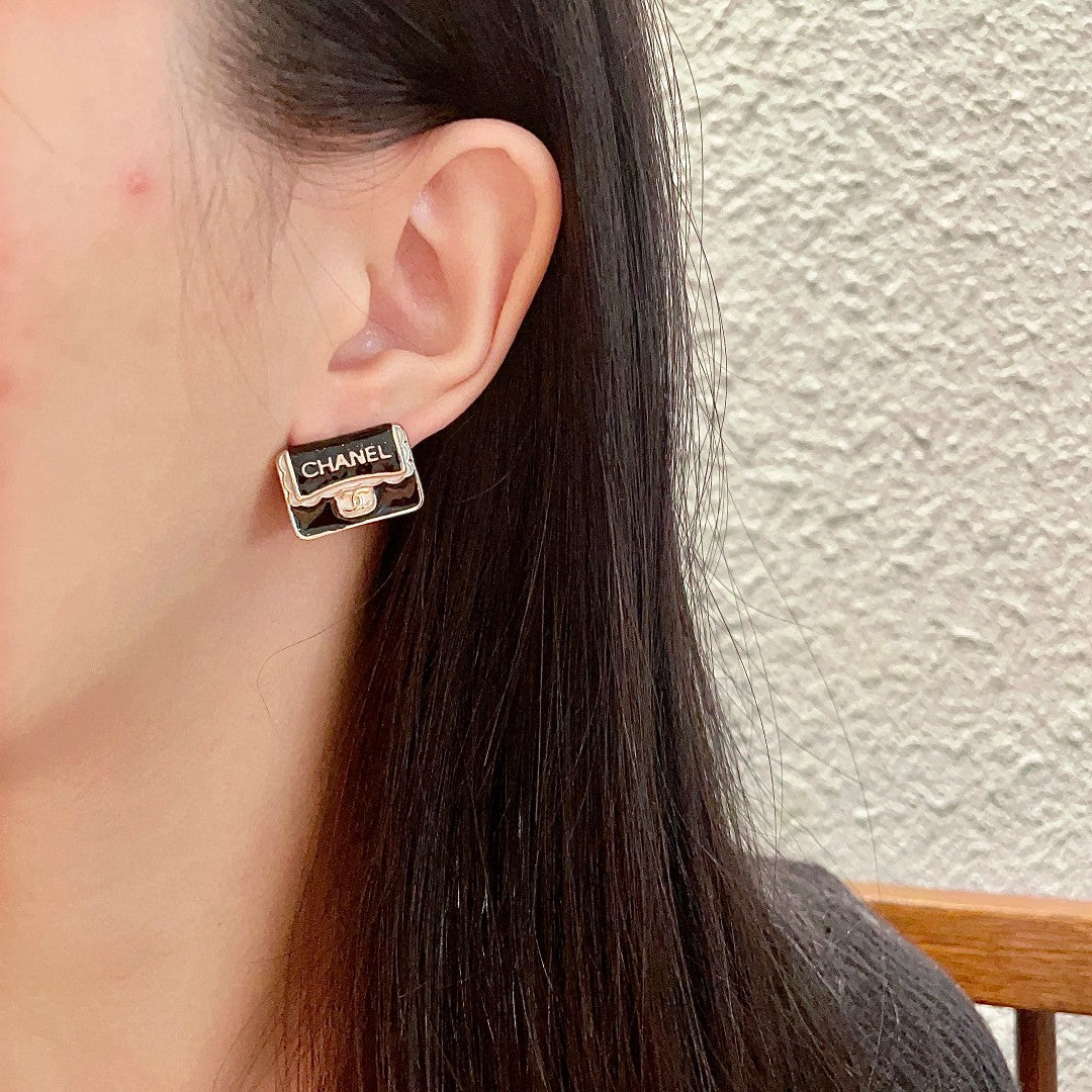 Double-C Emblem Stud Earrings in Polished Metal-Tone – Design 375 detail view
