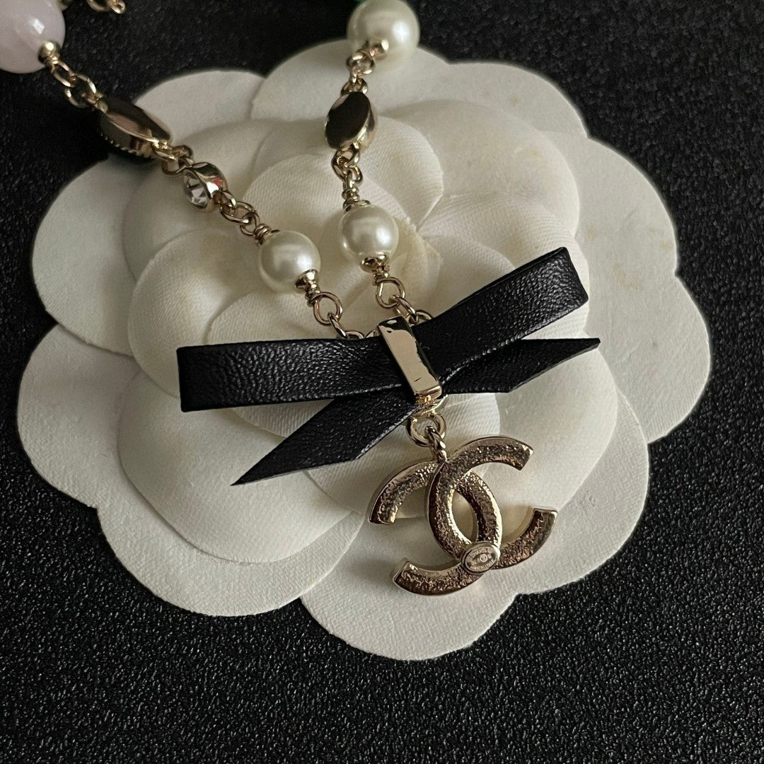 Double-C Emblem Pendant Necklace in Polished Metal-Tone – Design 069 front product view
