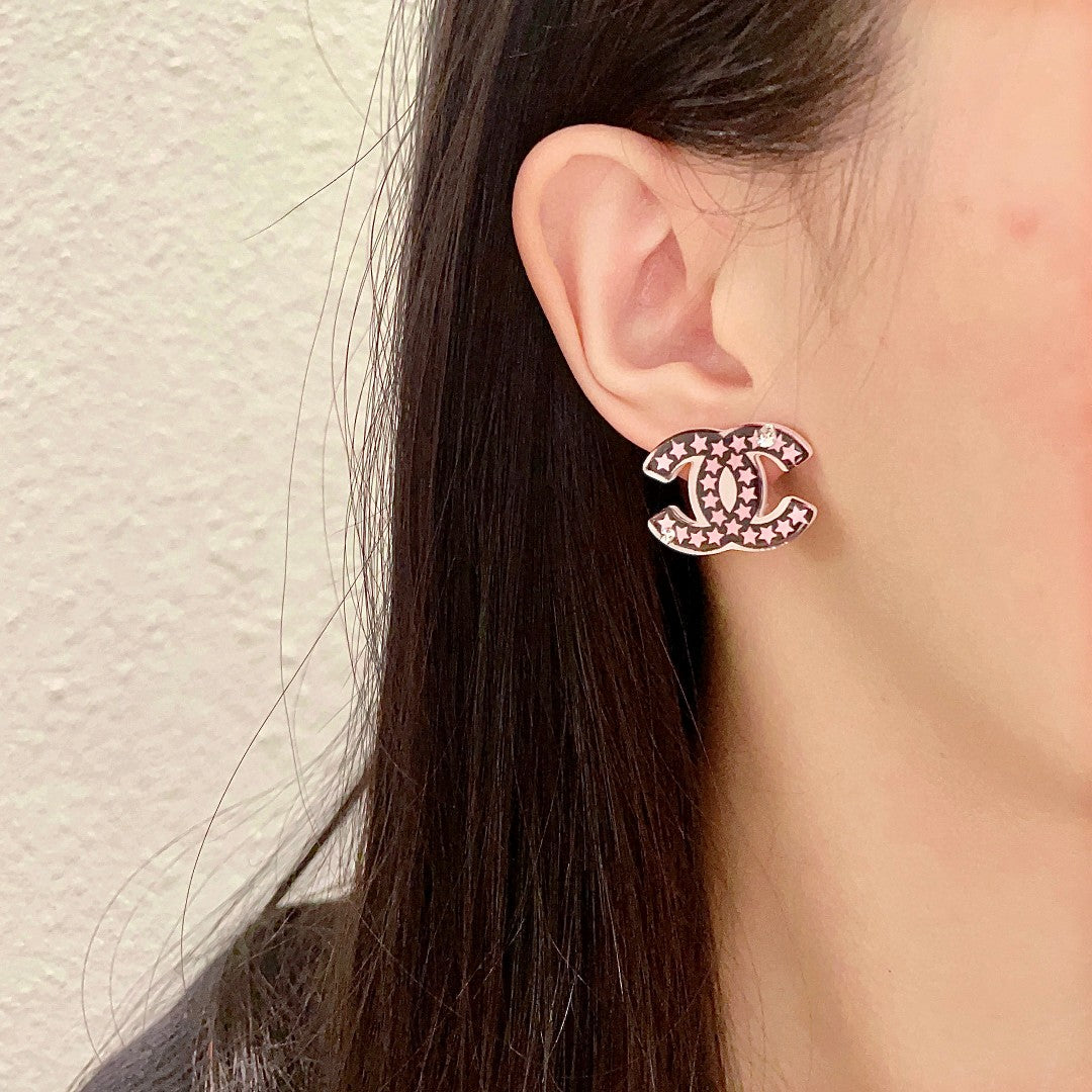 Double-C Emblem Stud Earrings in Polished Metal-Tone – Star Detail – Design 019 detail view