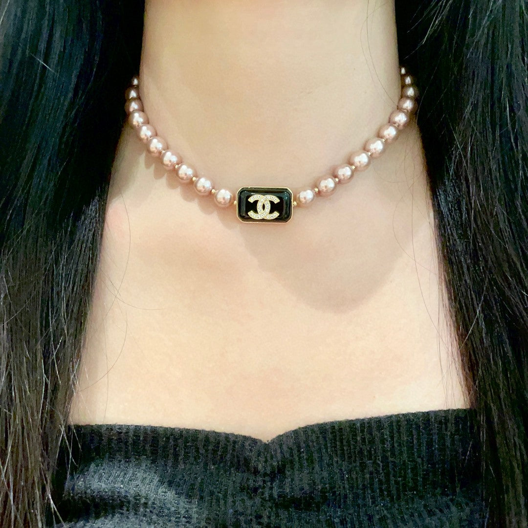Double-C Emblem Pearl-Detail Pendant Necklace – Pearl Detail – Design 101 detail view