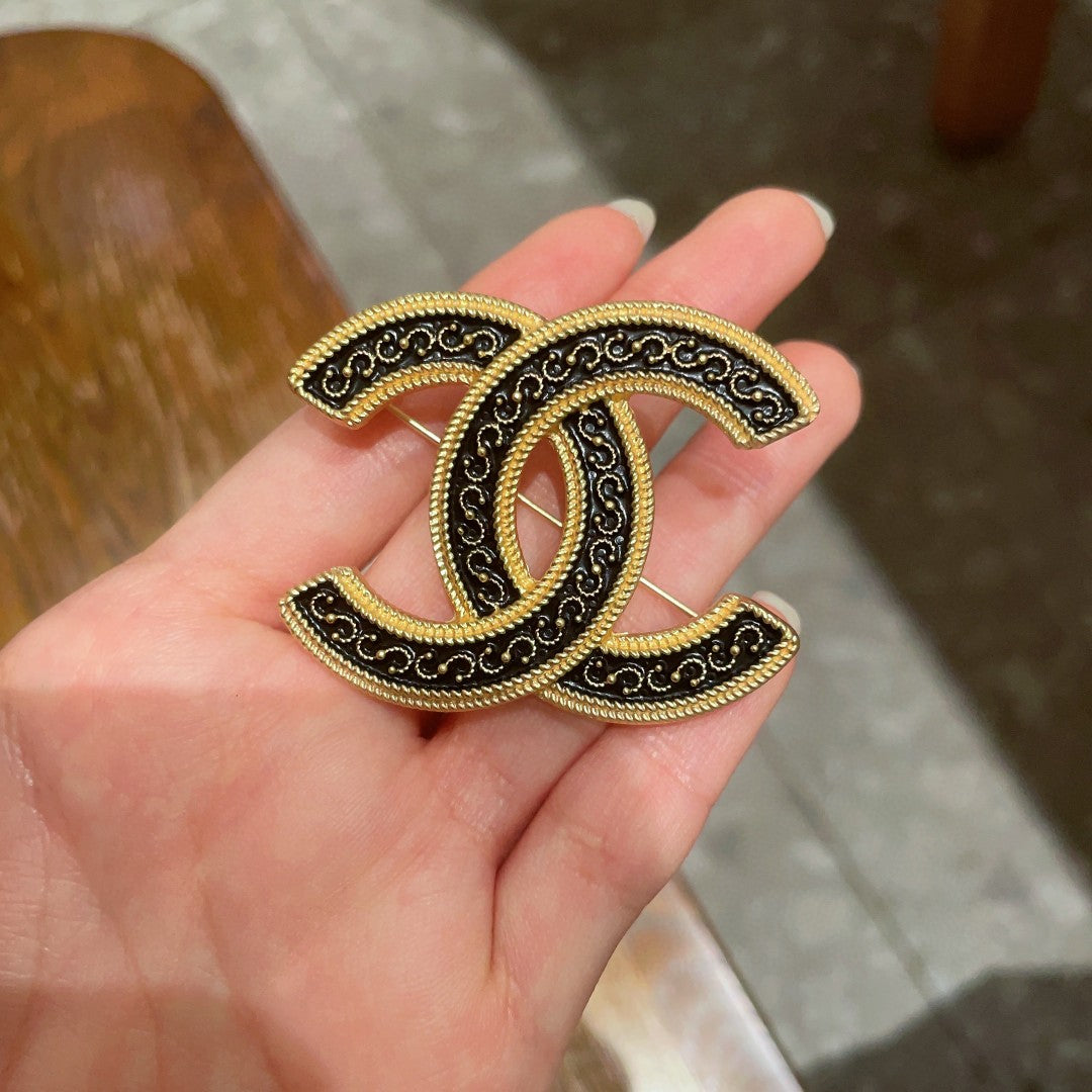 Double-C Emblem Brooch in Polished Metal-Tone – Design 068 detail view
