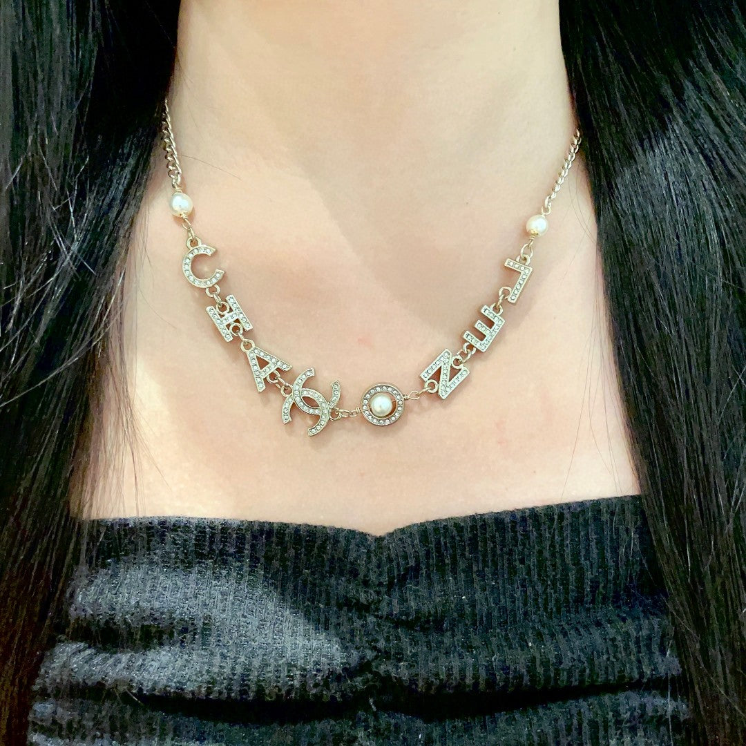 Double-C Emblem Pendant Necklace in Polished Metal-Tone – Design 055 detail view