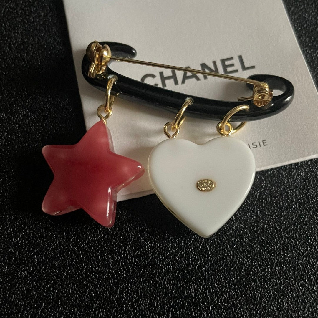 Double-C Emblem Brooch in Polished Metal-Tone – Star Detail main product view