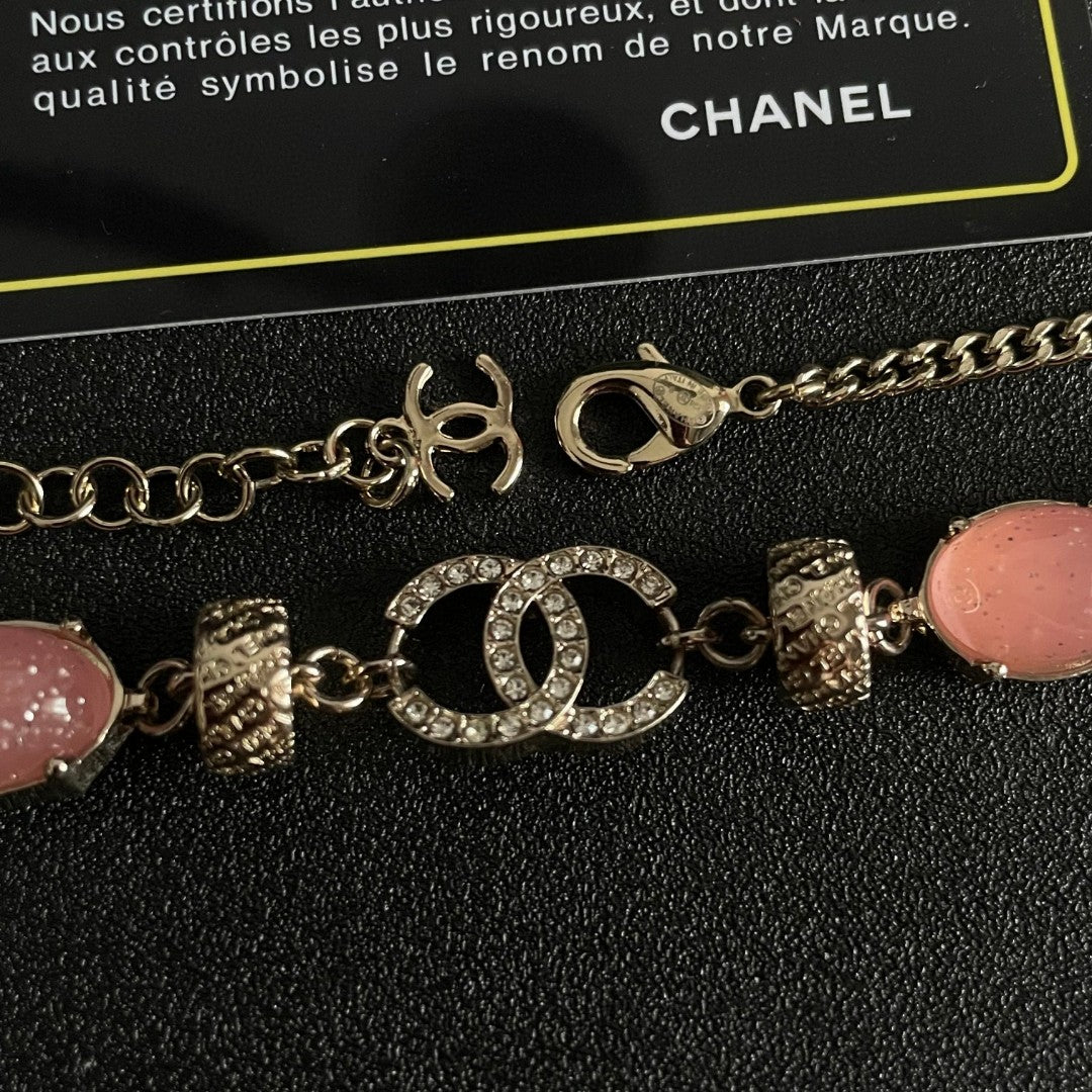 Double-C Emblem Pendant Necklace in Polished Metal-Tone – Pink Detail detail view