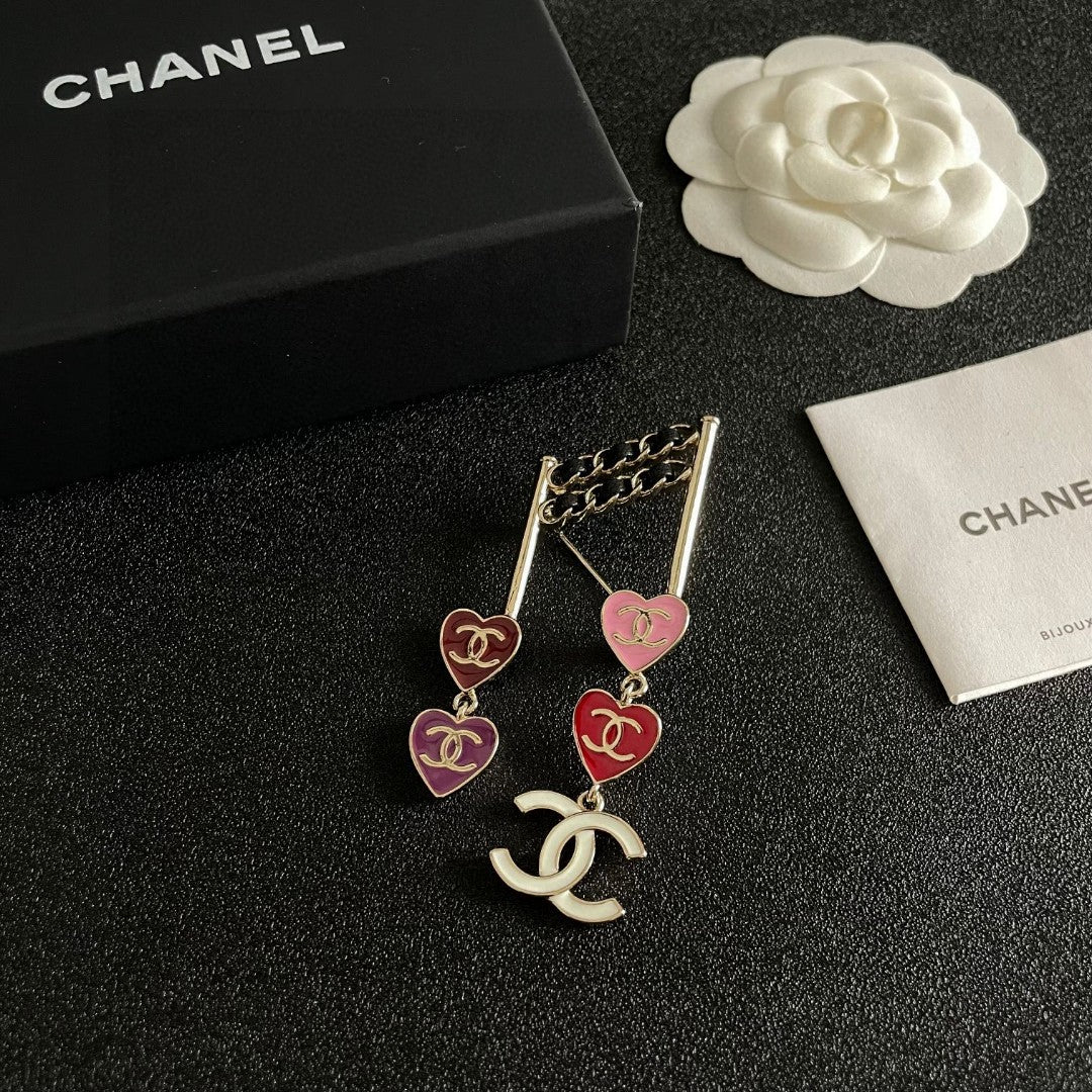 Double-C Emblem Brooch in Polished Metal-Tone – Heart Detail styled product view