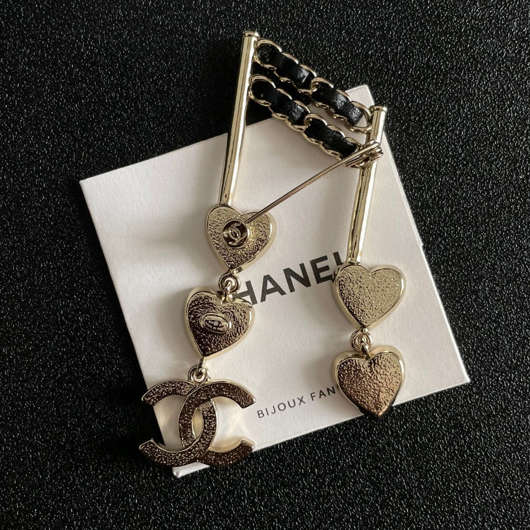 Double-C Emblem Brooch in Polished Metal-Tone – Heart Detail main product view