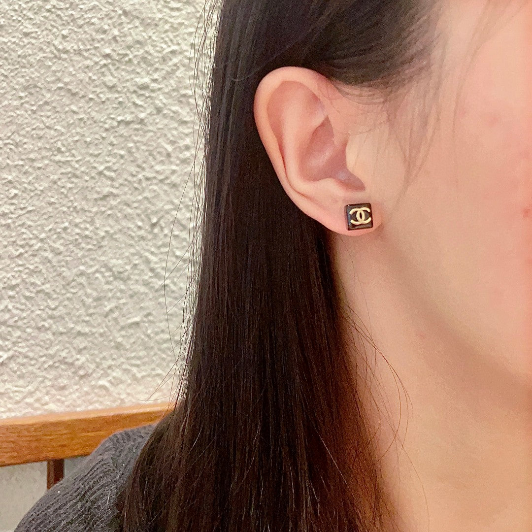 Double-C Emblem Stud Earrings in Polished Metal-Tone – Design 296 detail view