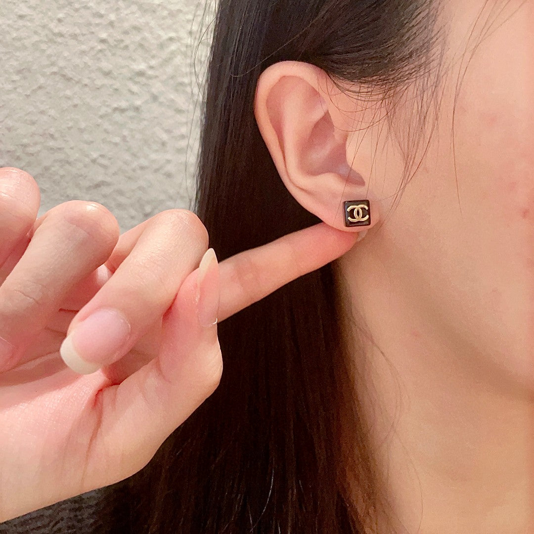 Double-C Emblem Stud Earrings in Polished Metal-Tone – Design 296 front product view