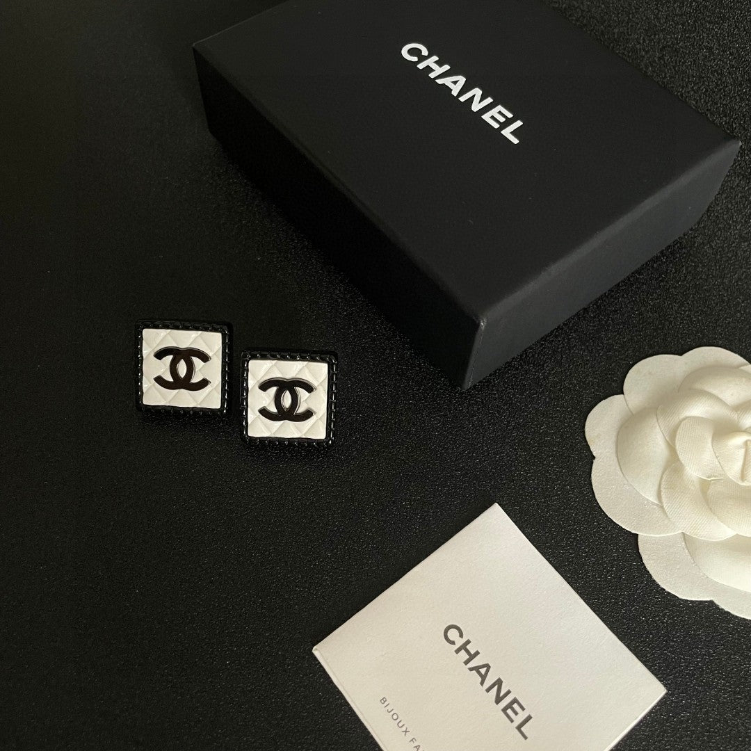 Double-C Emblem Stud Earrings in Polished Metal-Tone – Design 228 close-up detail
