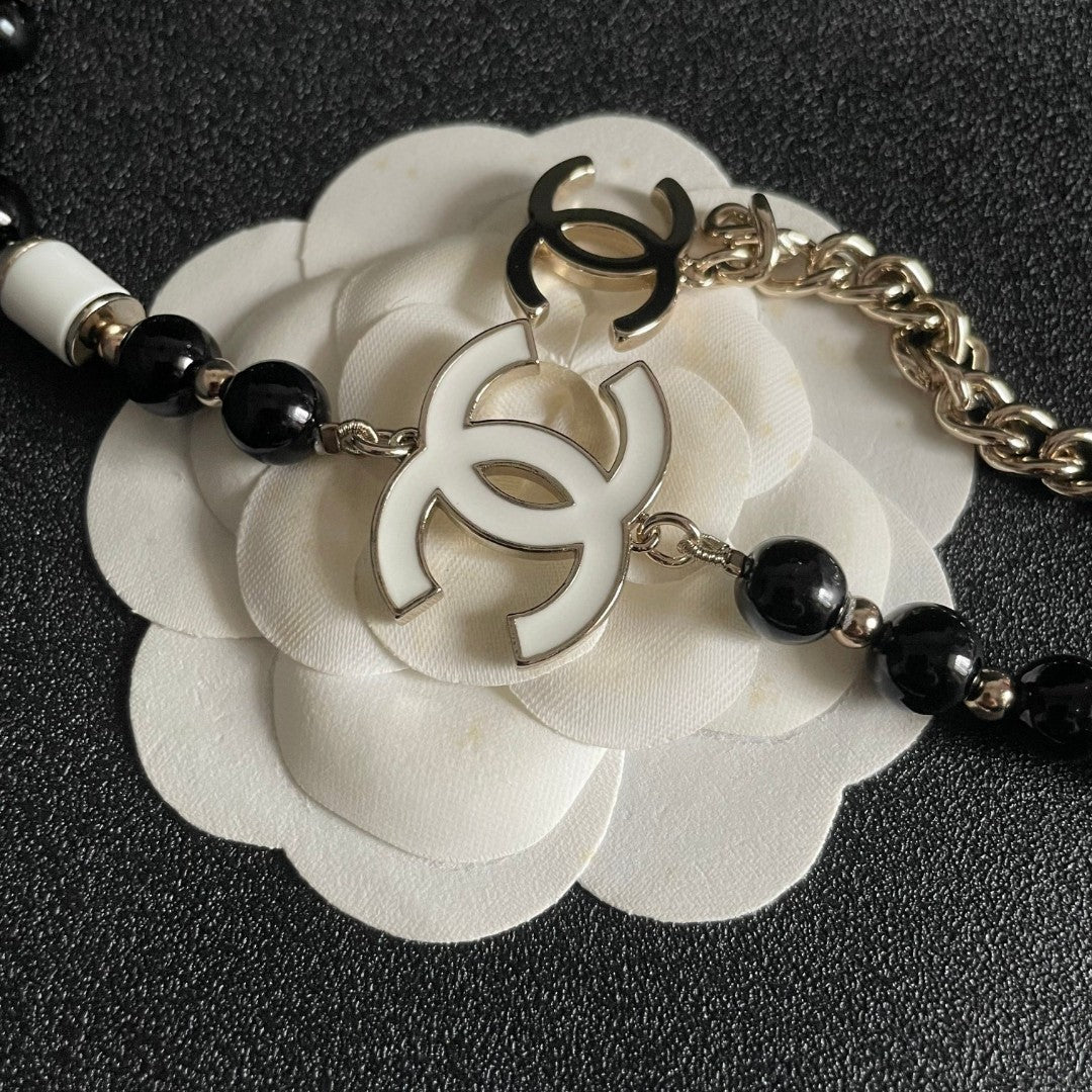 Double-C Emblem Pendant Necklace in Polished Metal-Tone – Black Detail main product view