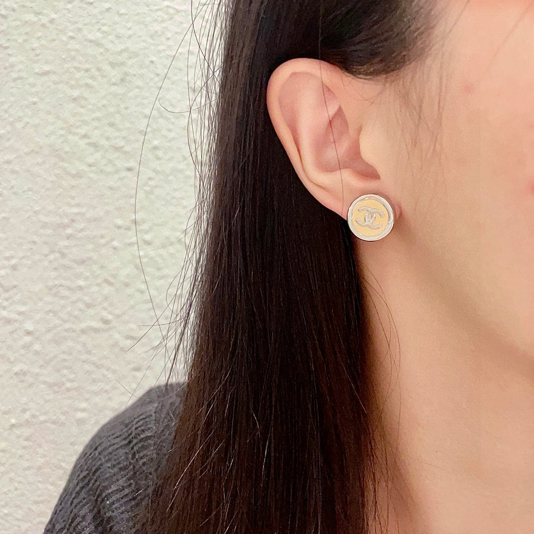 Double-C Emblem Stud Earrings in Polished Metal-Tone – Design 222 detail view