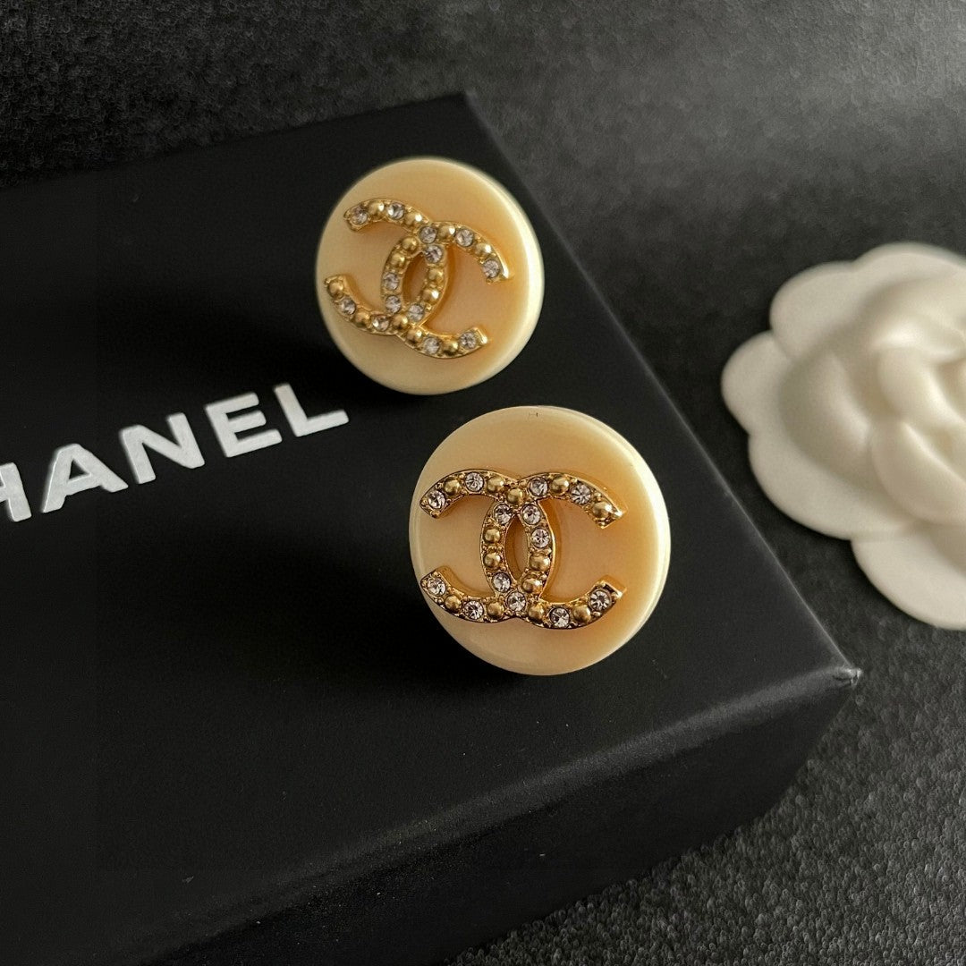 Double-C Emblem Stud Earrings in Polished Metal-Tone – Design 220 detail view