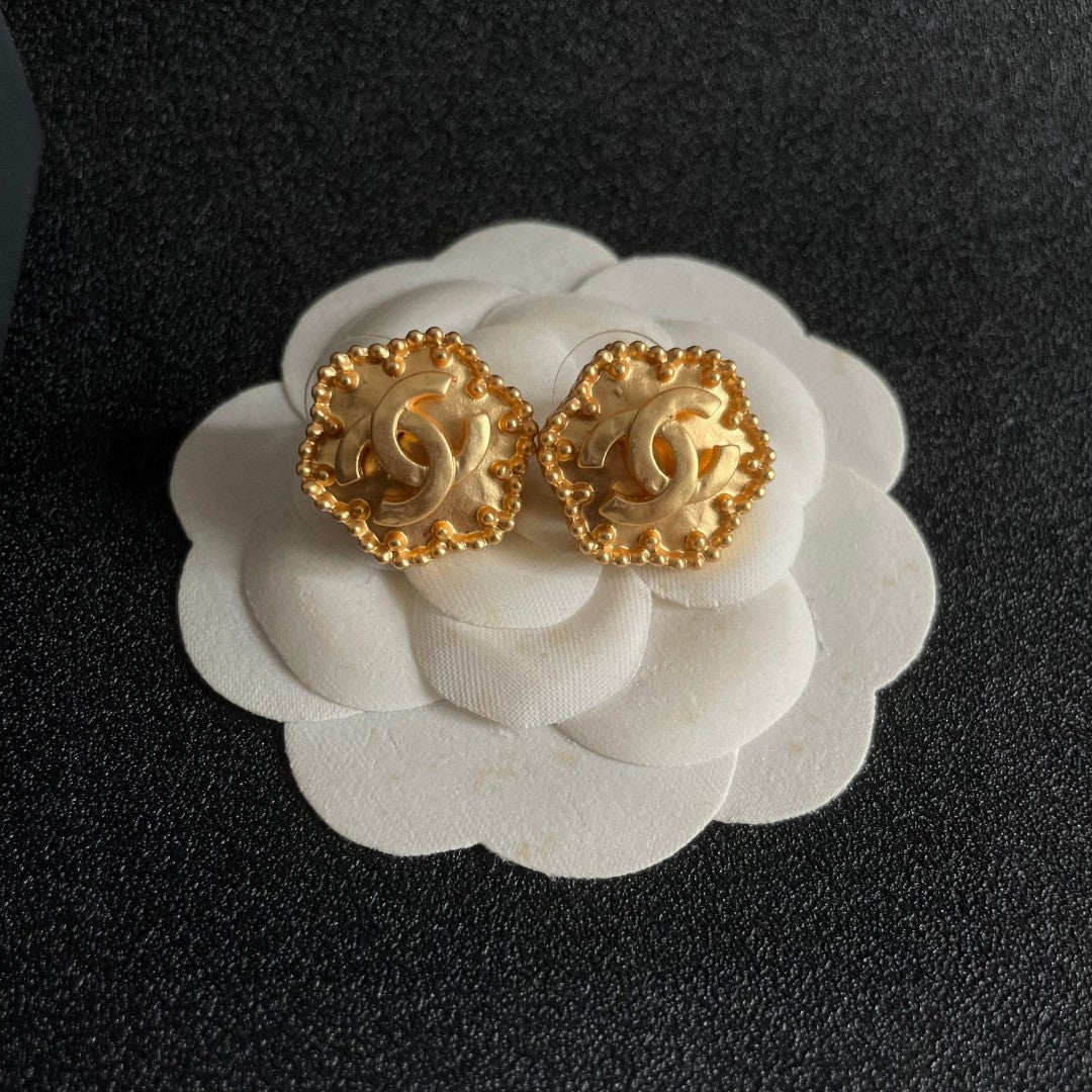 Double-C Emblem Stud Earrings in Polished Metal-Tone – Design 150 front product view