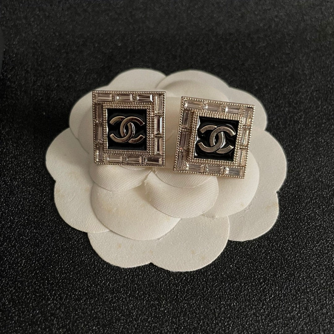 Double-C Emblem Stud Earrings in Polished Metal-Tone – Design 148 front product view