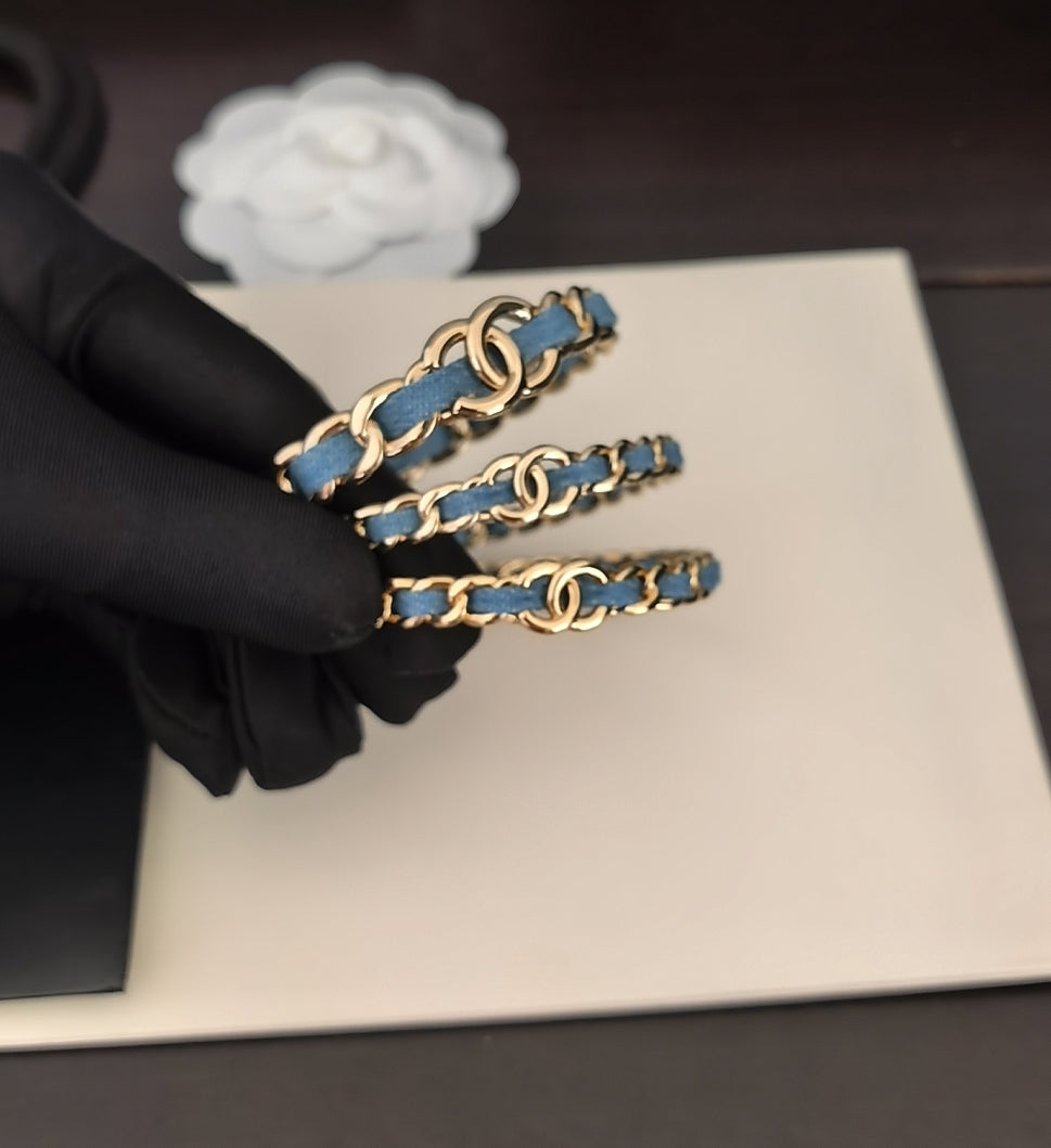 Signature Emblem Bangle in Gold-Tone – Blue Detail close-up detail