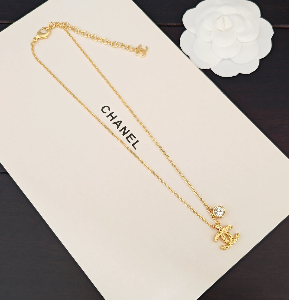 Signature Emblem Crystal-Accent Pendant Necklace – White Detail – Design 003 close-up detail