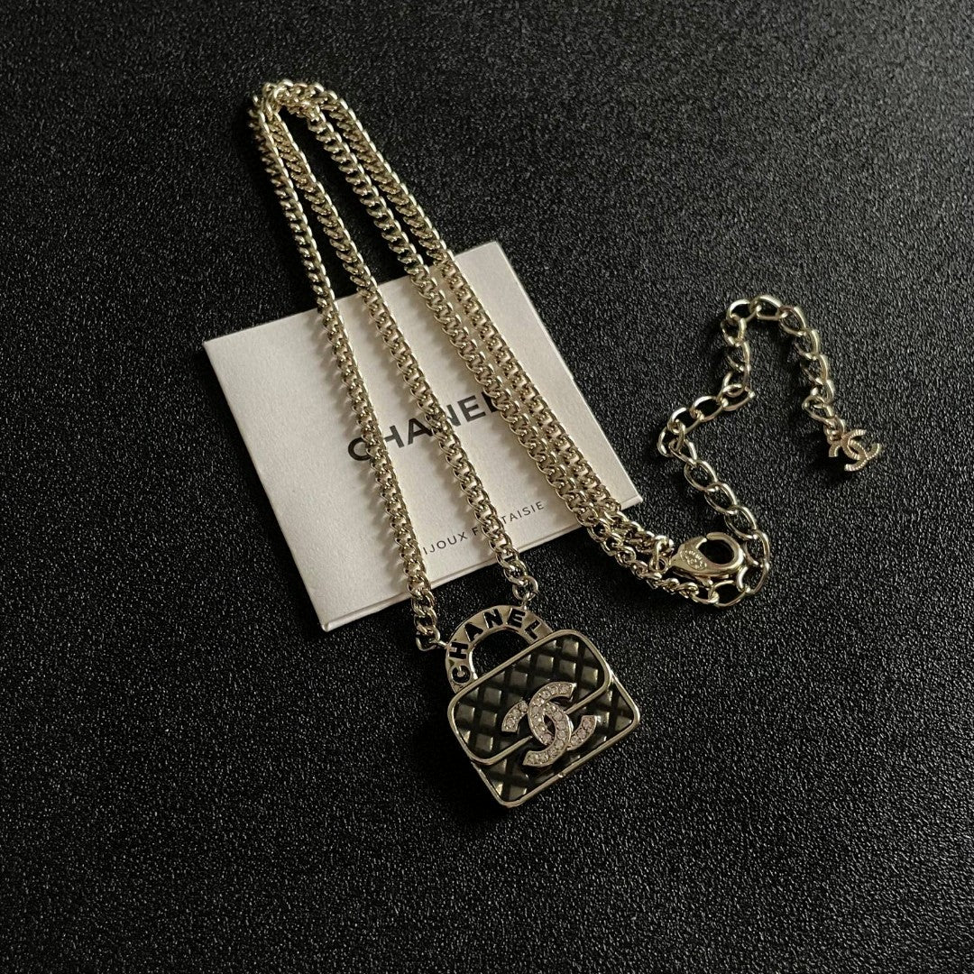 Double-C Emblem Pendant Necklace in Polished Metal-Tone – Design 022 detail view