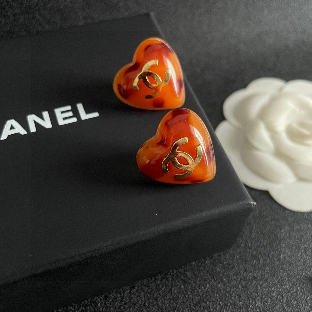 Double-C Emblem Stud Earrings in Polished Metal-Tone – Heart Detail detail view
