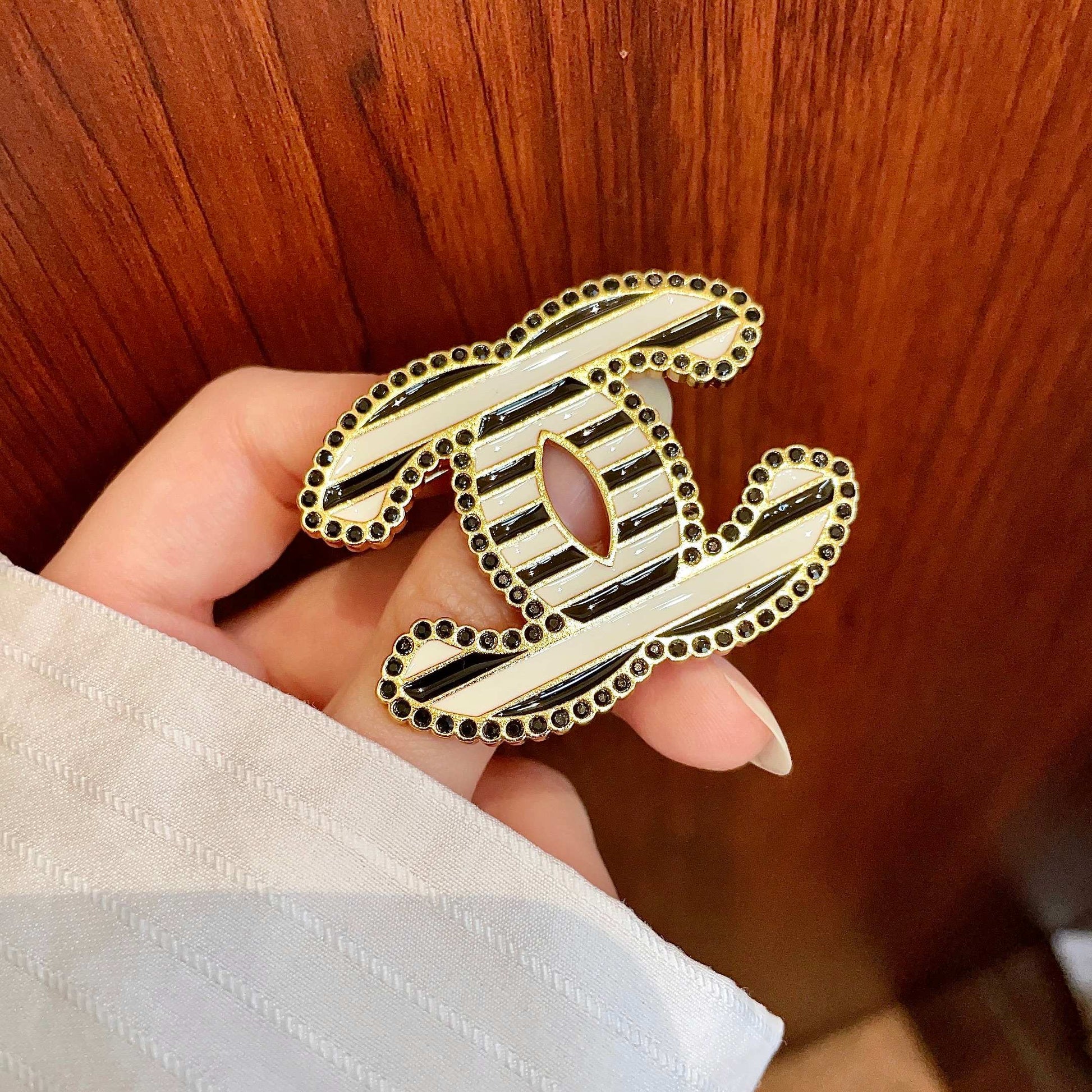 Double-C Emblem Brooch in Polished Metal-Tone – Design 044 detail view