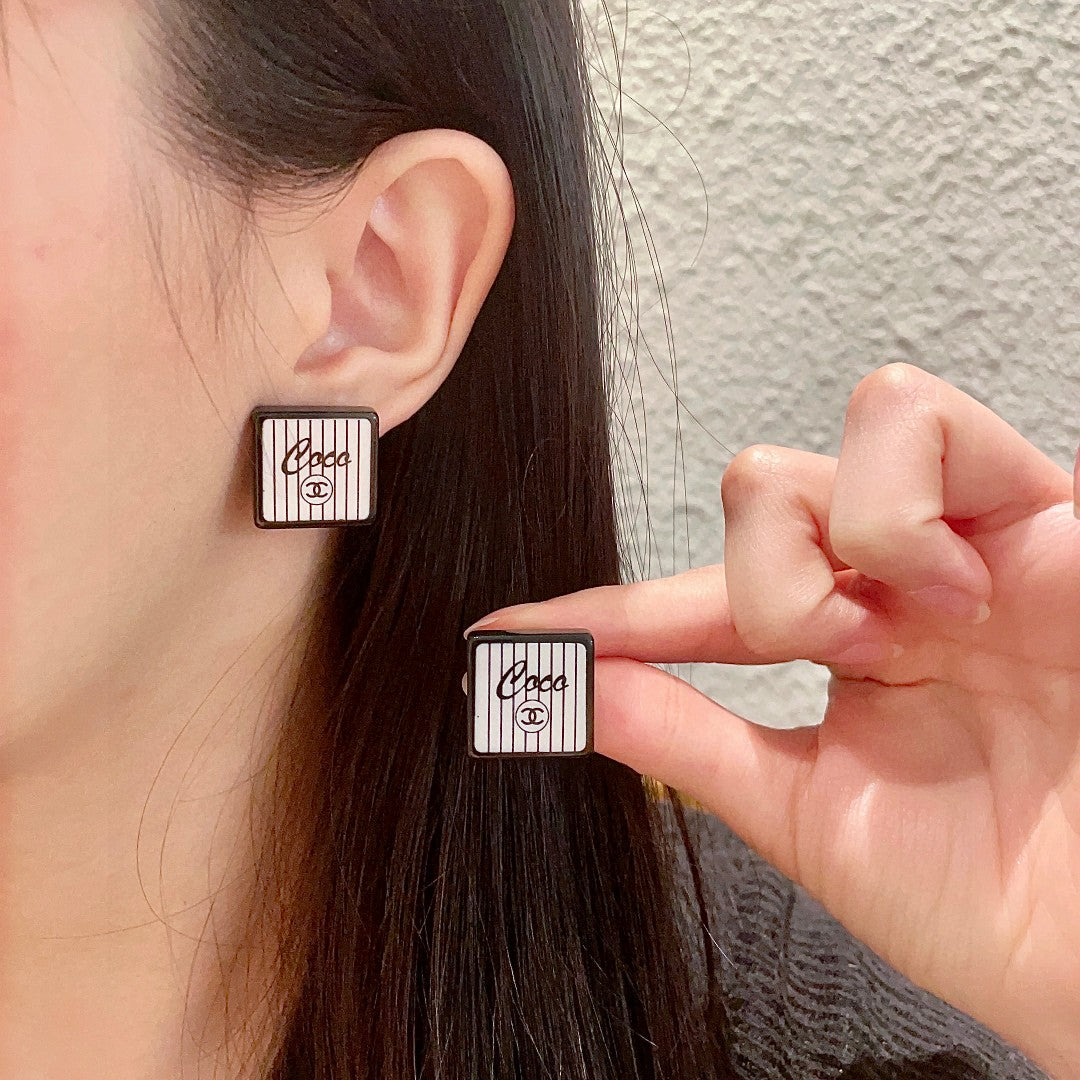 Double-C Emblem Stud Earrings in Polished Metal-Tone – Design 232 main product view