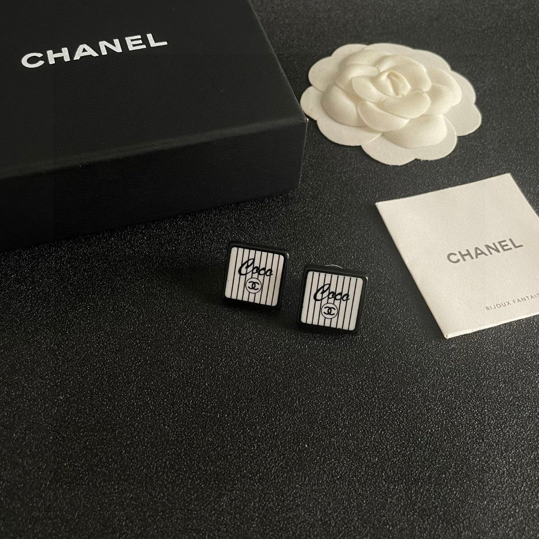 Double-C Emblem Stud Earrings in Polished Metal-Tone – Design 232 styled product view