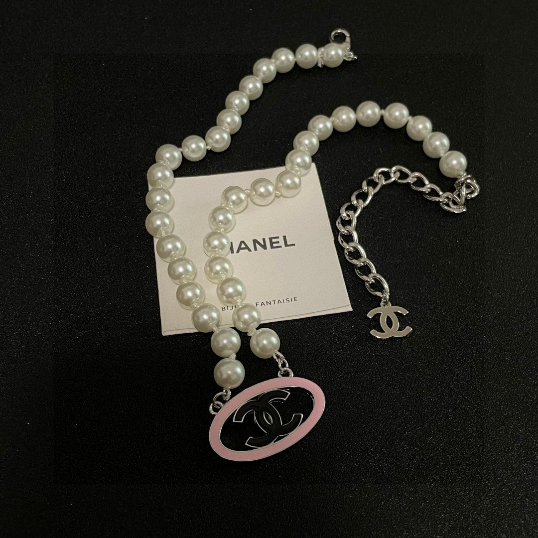 Double-C Emblem Pearl-Detail Pendant Necklace – Pearl Detail – Design 077 detail view