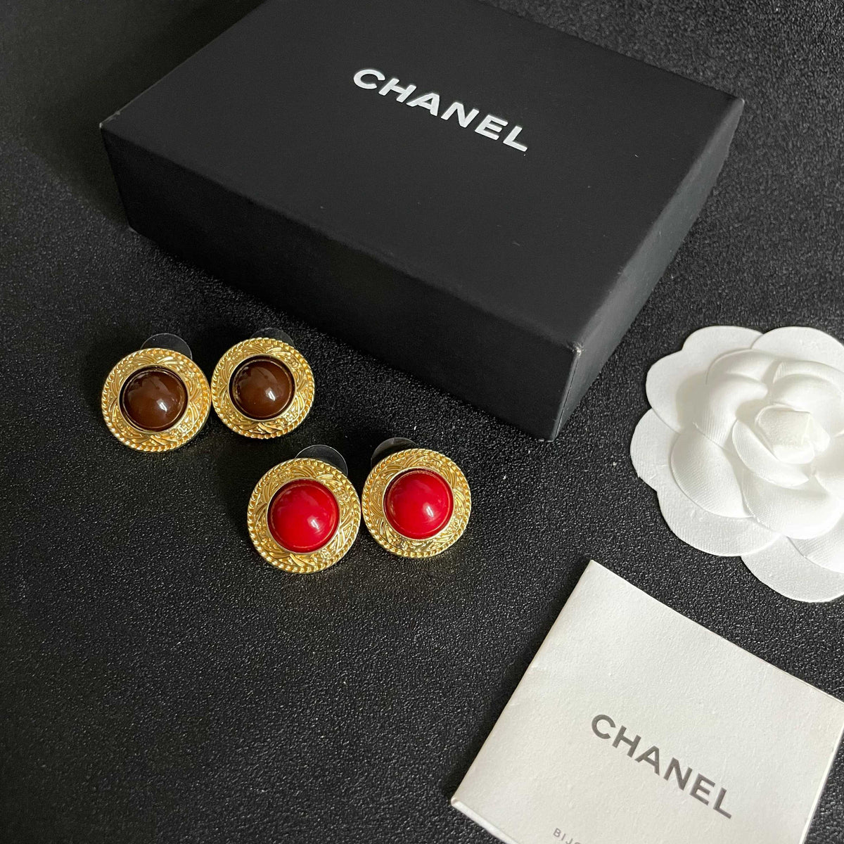 Double-C Emblem Stud Earrings in Polished Metal-Tone – Design 066 close-up detail