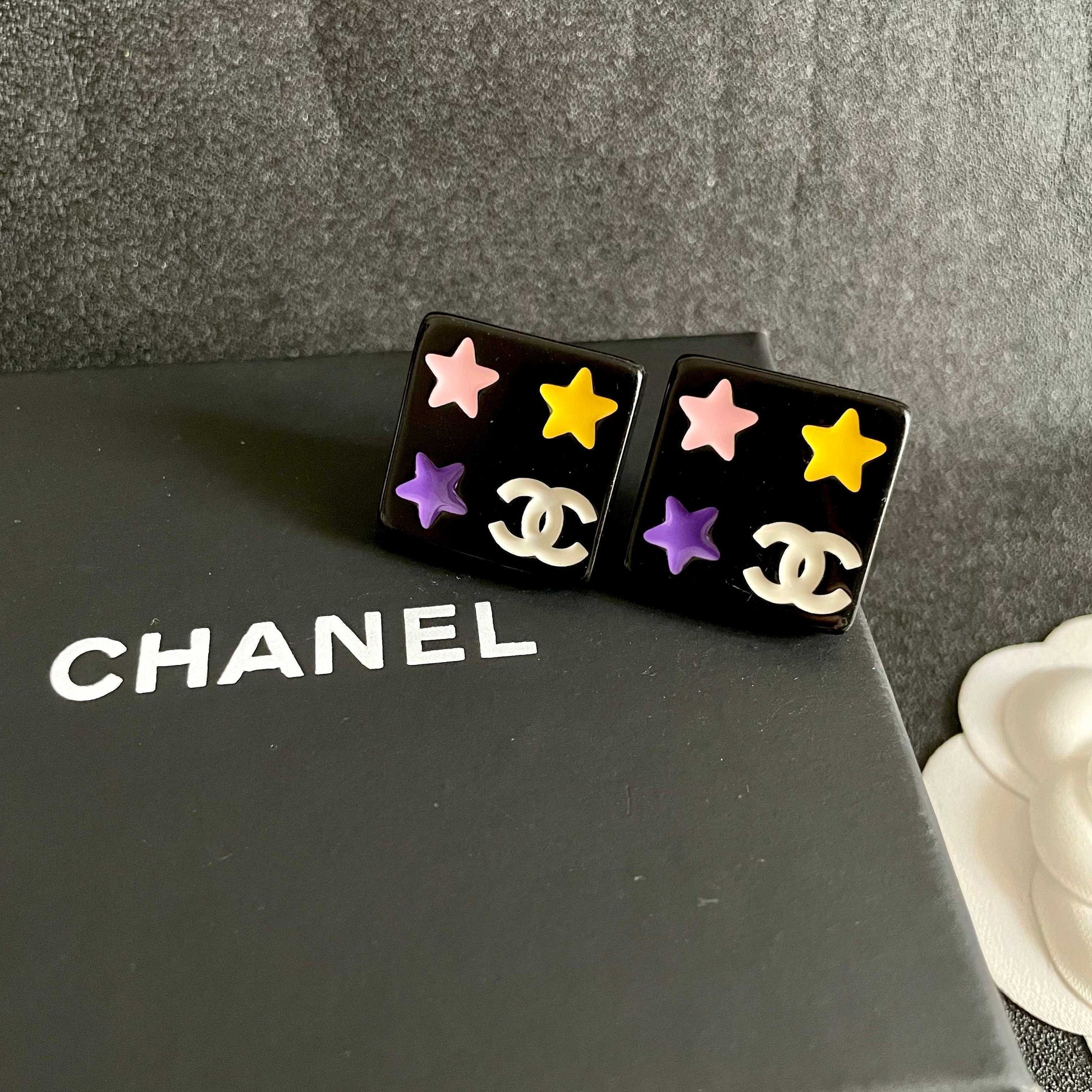Double-C Emblem Stud Earrings in Polished Metal-Tone – Star Detail – Design 002 detail view