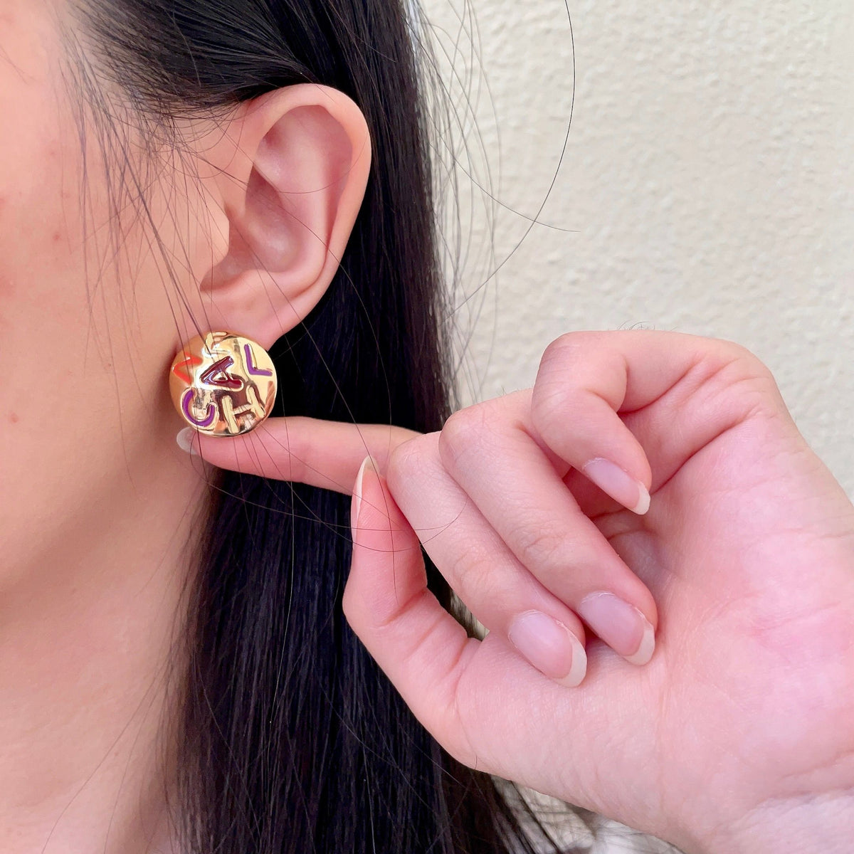 Double-C Emblem Stud Earrings in Polished Metal-Tone – Design 245 front product view