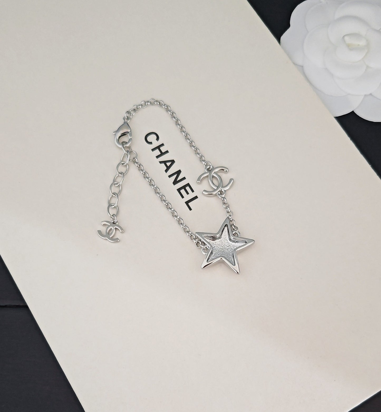 Signature Emblem Bracelet in Gold-Tone – White Detail front product view