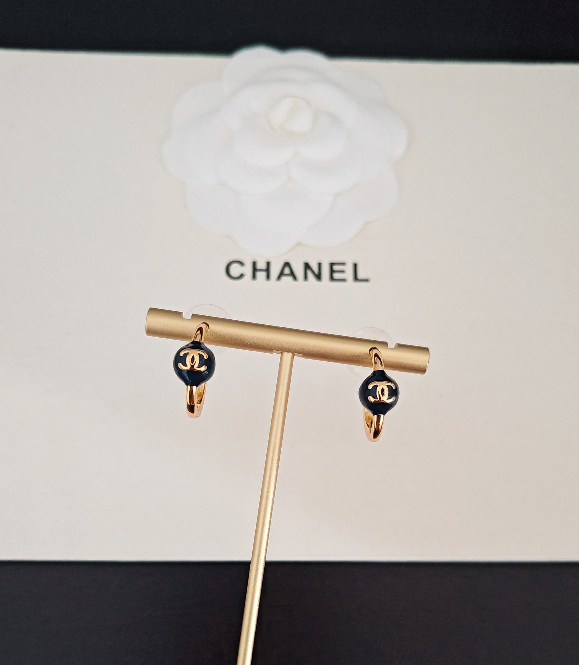 Signature Emblem Jewelry Accessory in Gold-Tone – Blue Detail close-up detail
