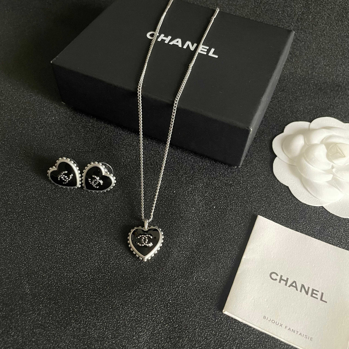 Double-C Emblem Stud Earrings in Polished Metal-Tone – Heart Detail – Design 010 close-up detail