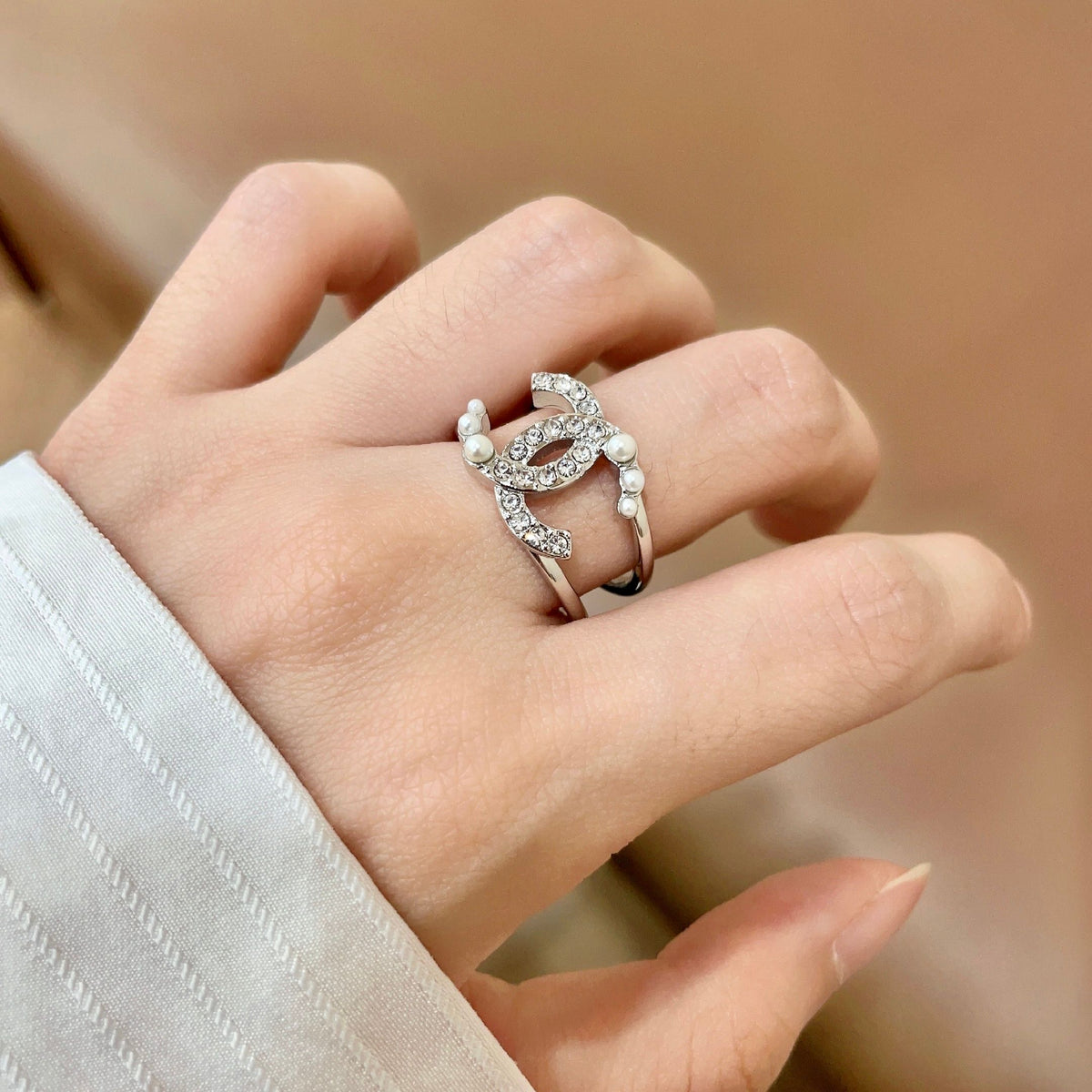 Double-C Emblem Statement Ring in Polished Metal-Tone – White Detail – Design 002 main product view