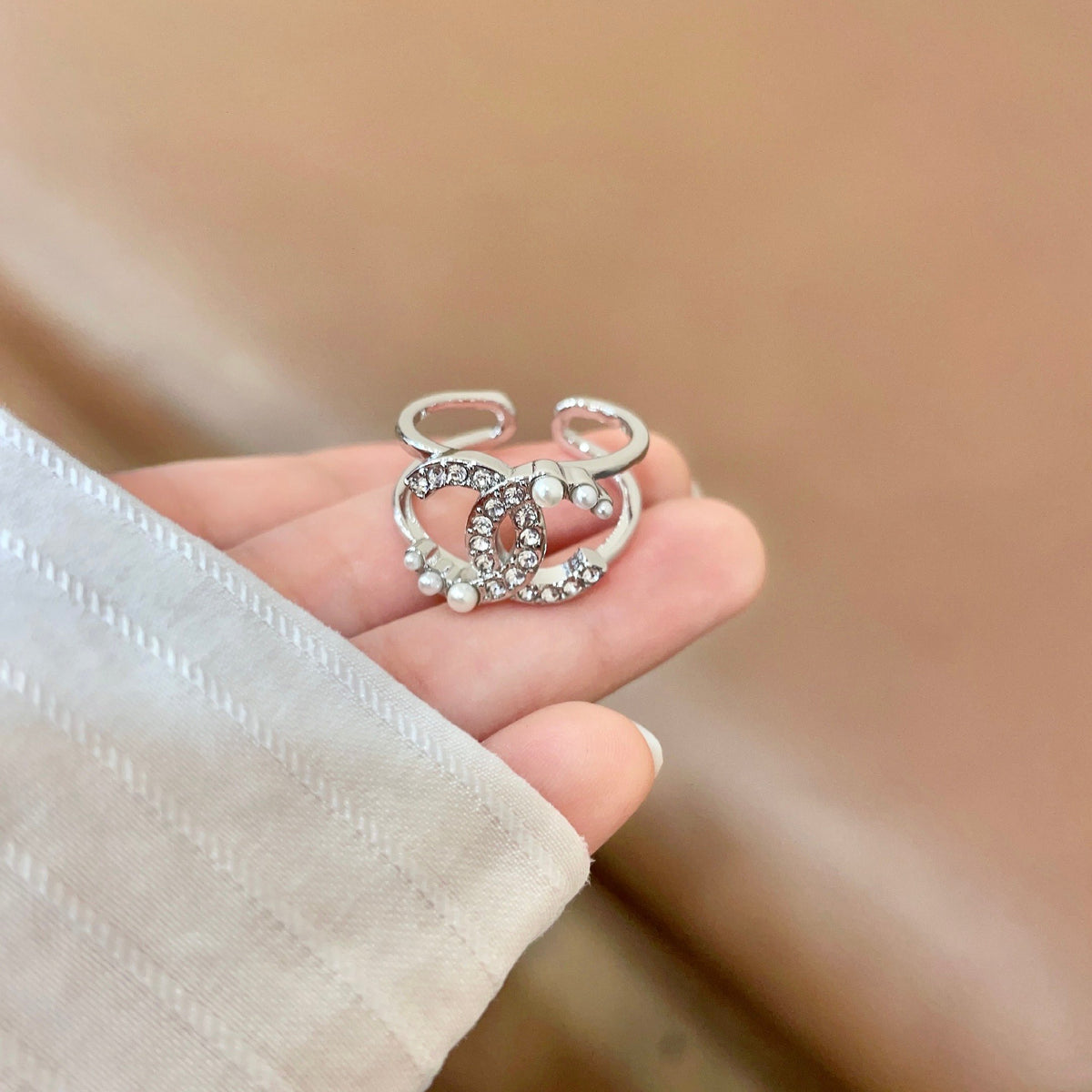 Double-C Emblem Statement Ring in Polished Metal-Tone – White Detail – Design 002 detail view