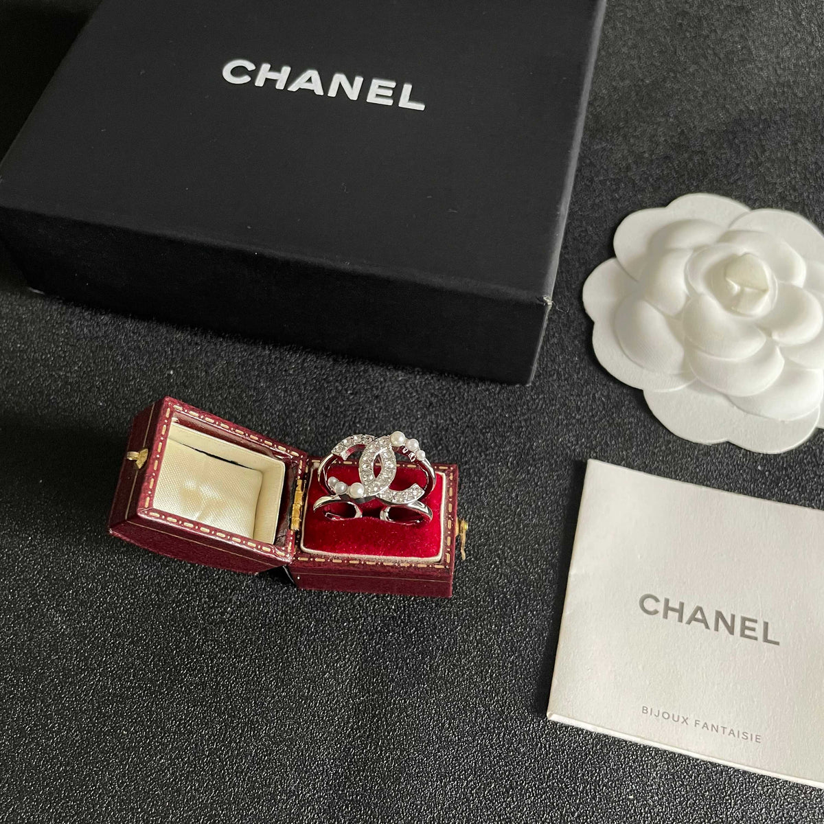Double-C Emblem Statement Ring in Polished Metal-Tone – White Detail – Design 002 close-up detail