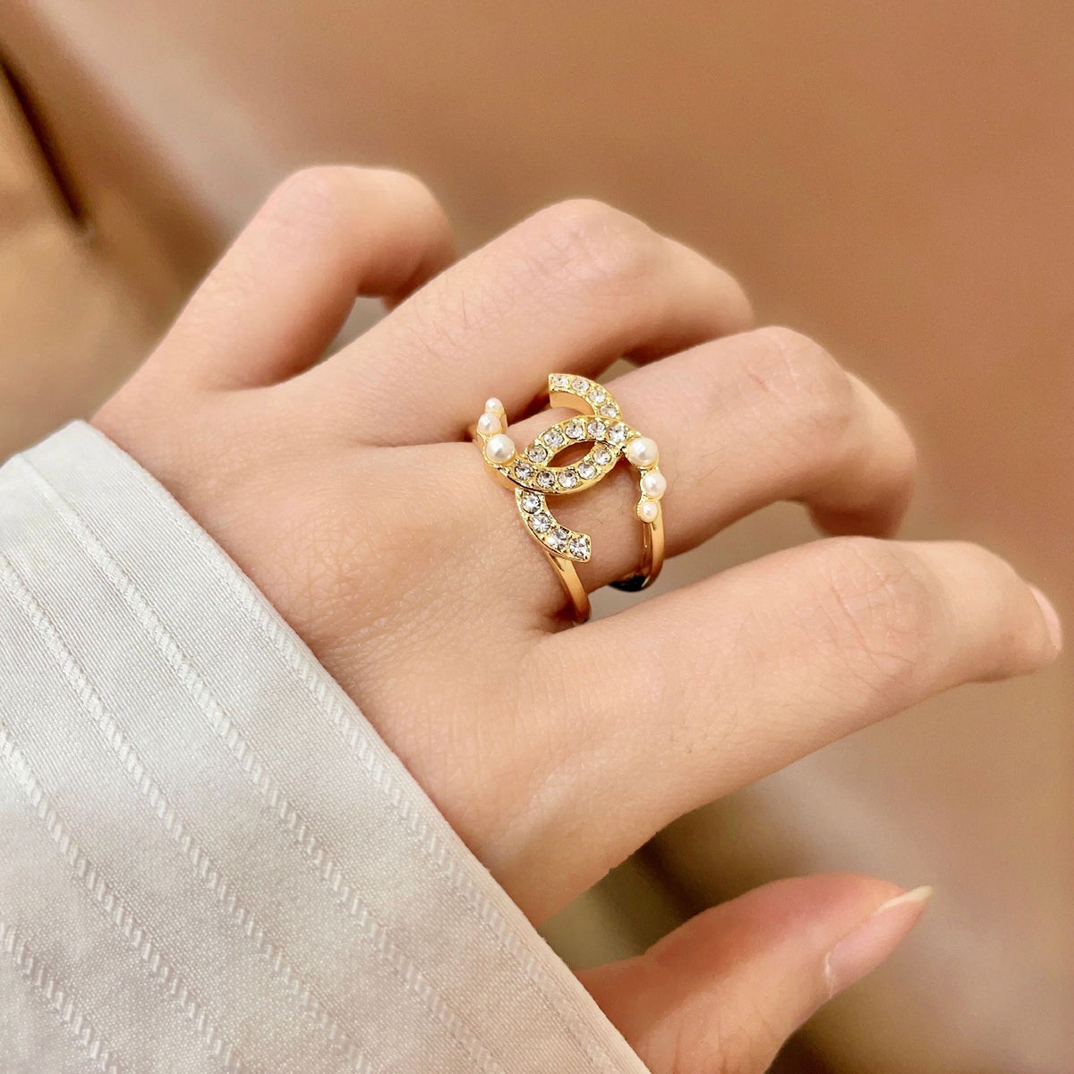 Double-C Emblem Statement Ring in Polished Metal-Tone – White Detail main product view