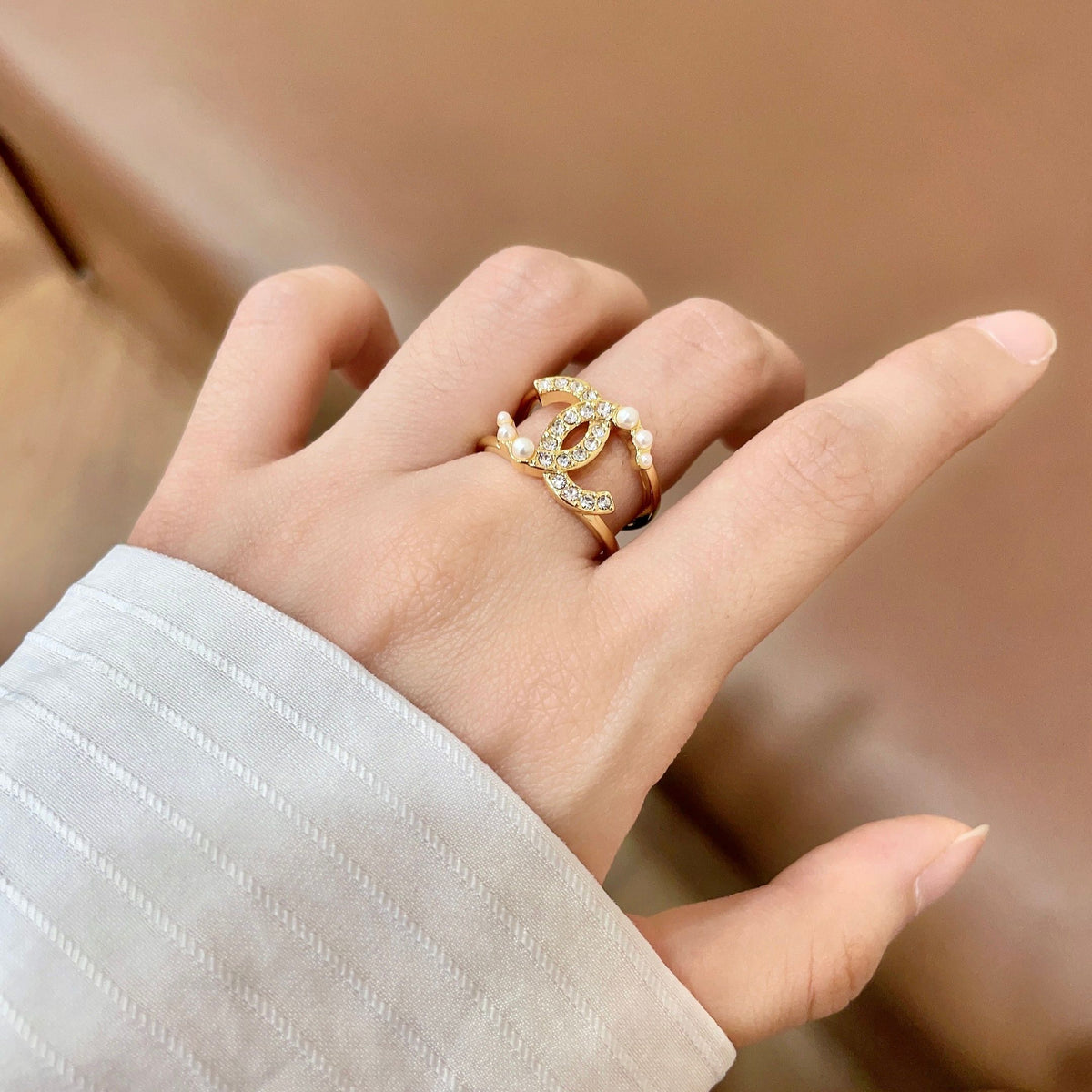 Double-C Emblem Statement Ring in Polished Metal-Tone – White Detail front product view