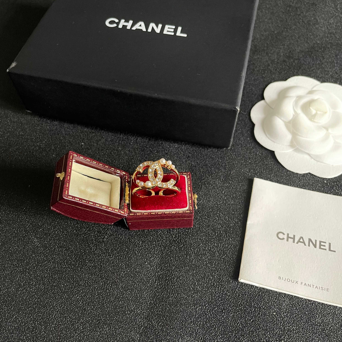 Double-C Emblem Statement Ring in Polished Metal-Tone – White Detail close-up detail