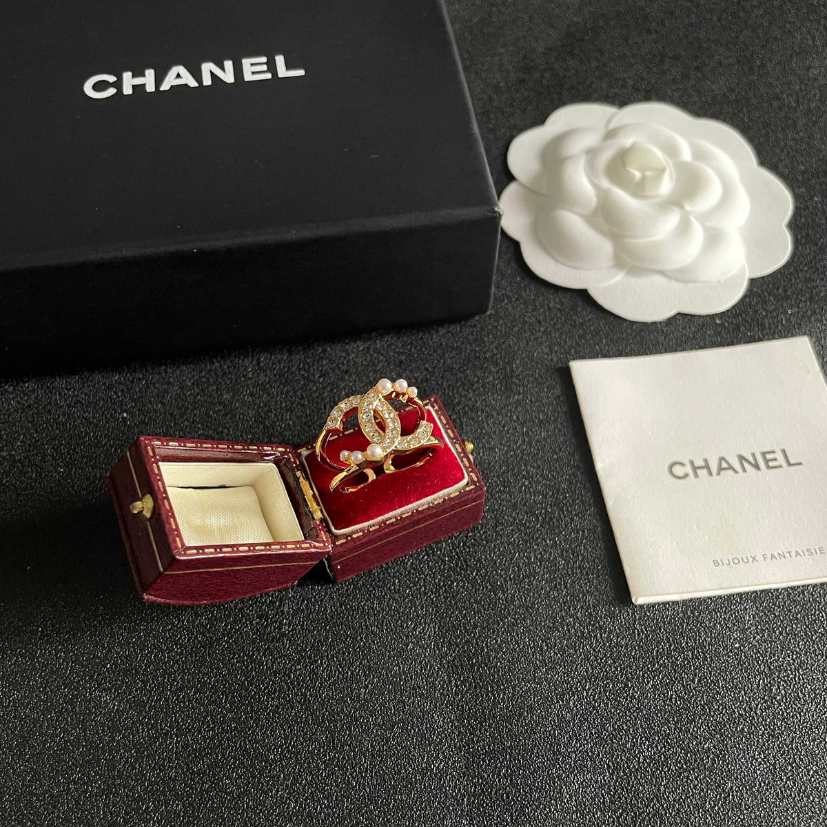 Double-C Emblem Statement Ring in Polished Metal-Tone – White Detail styled product view