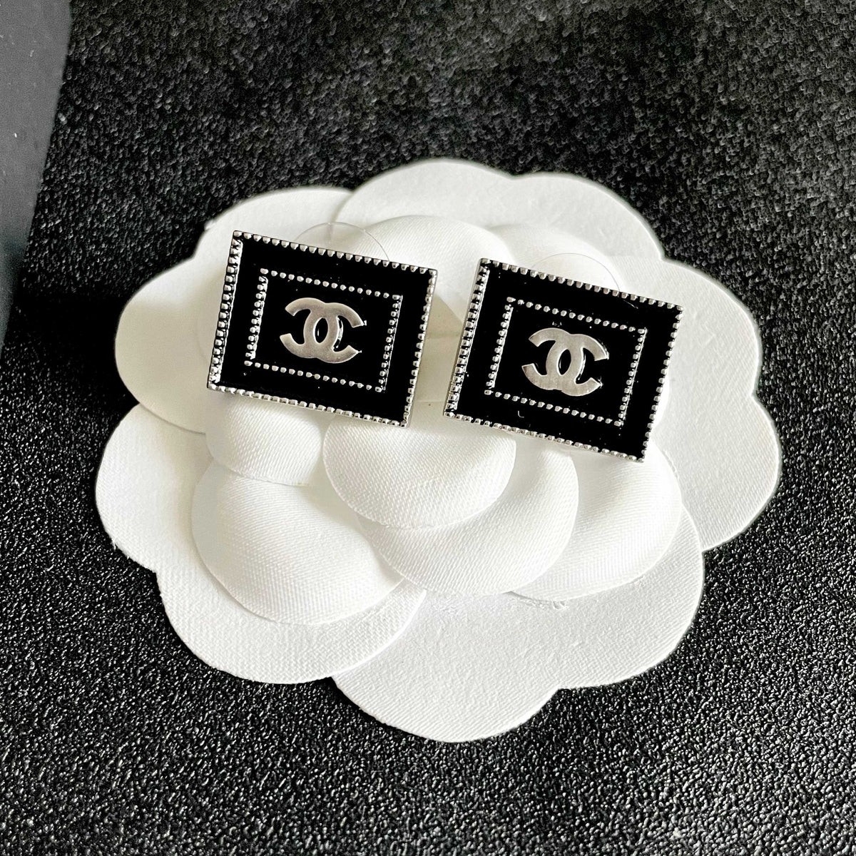 Double-C Emblem Stud Earrings in Polished Metal-Tone – Design 169 front product view