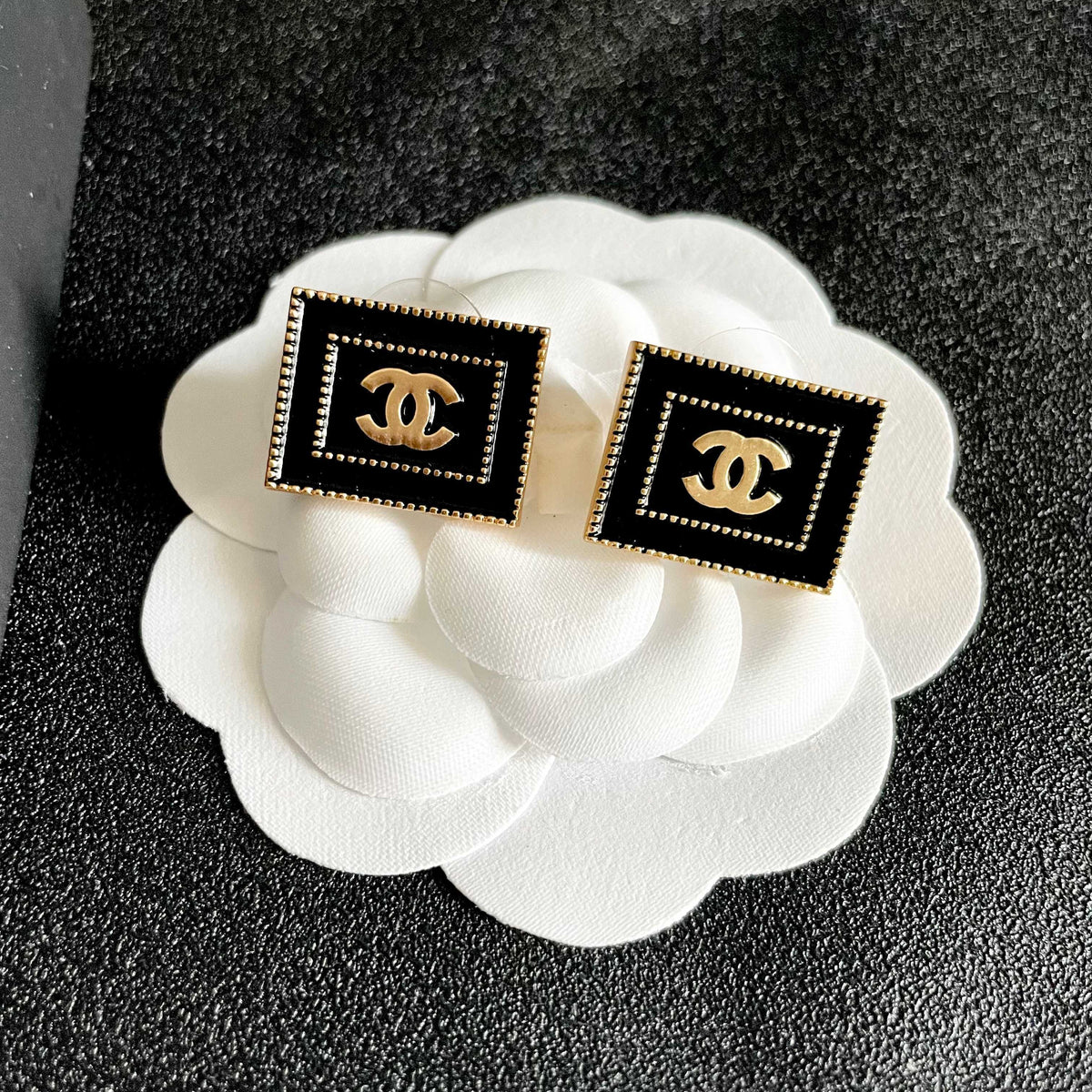 Double-C Emblem Stud Earrings in Polished Metal-Tone – Design 168 front product view